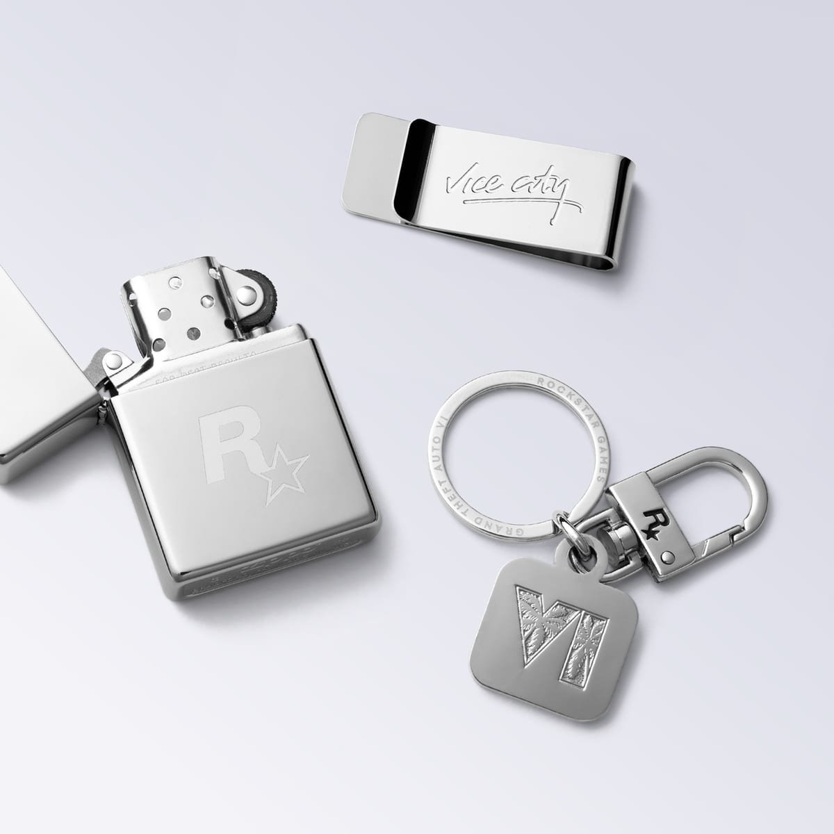 Isqueiro Zippo, money clip e chaveiro em metal cromado, com os logos de GTA 6